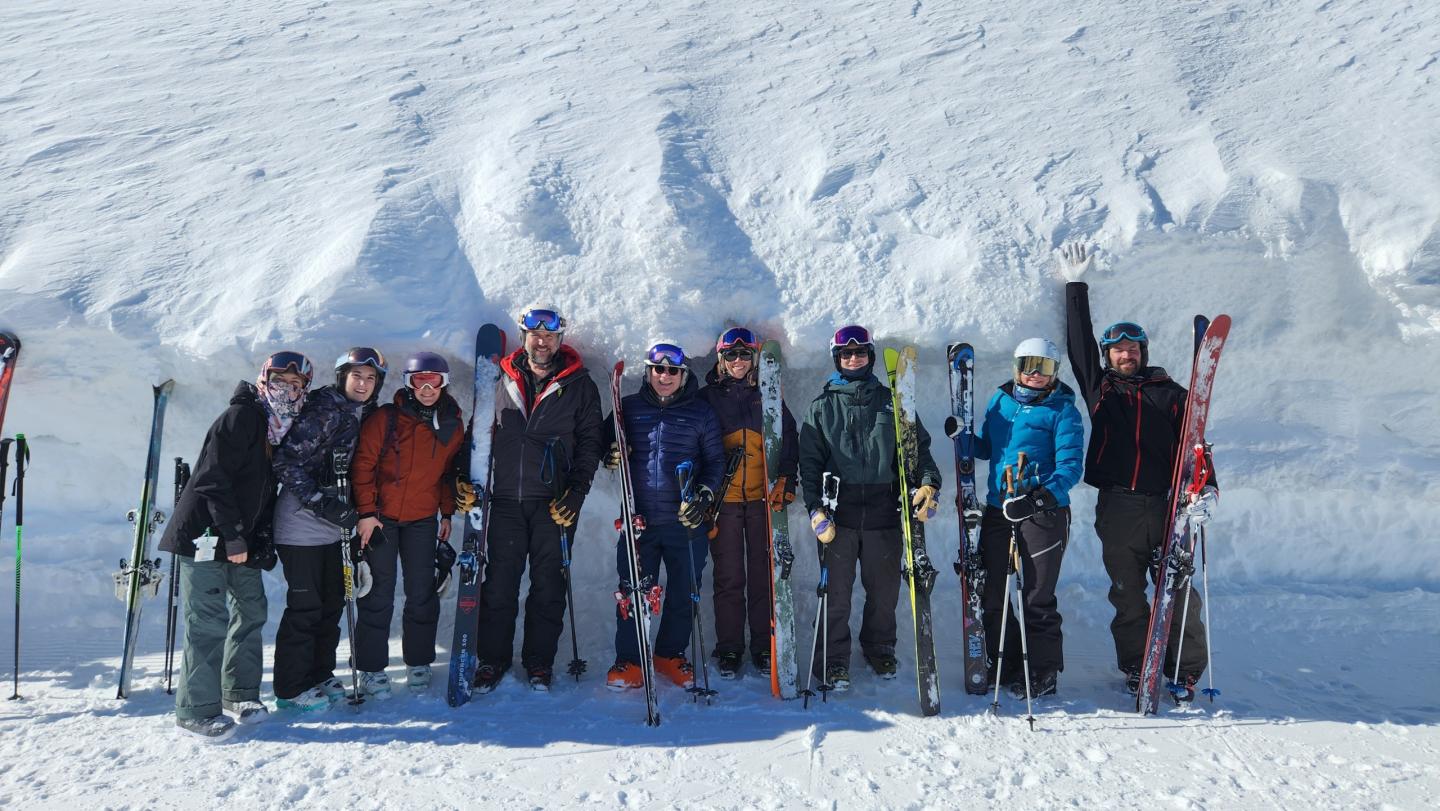 A group photo of skiers