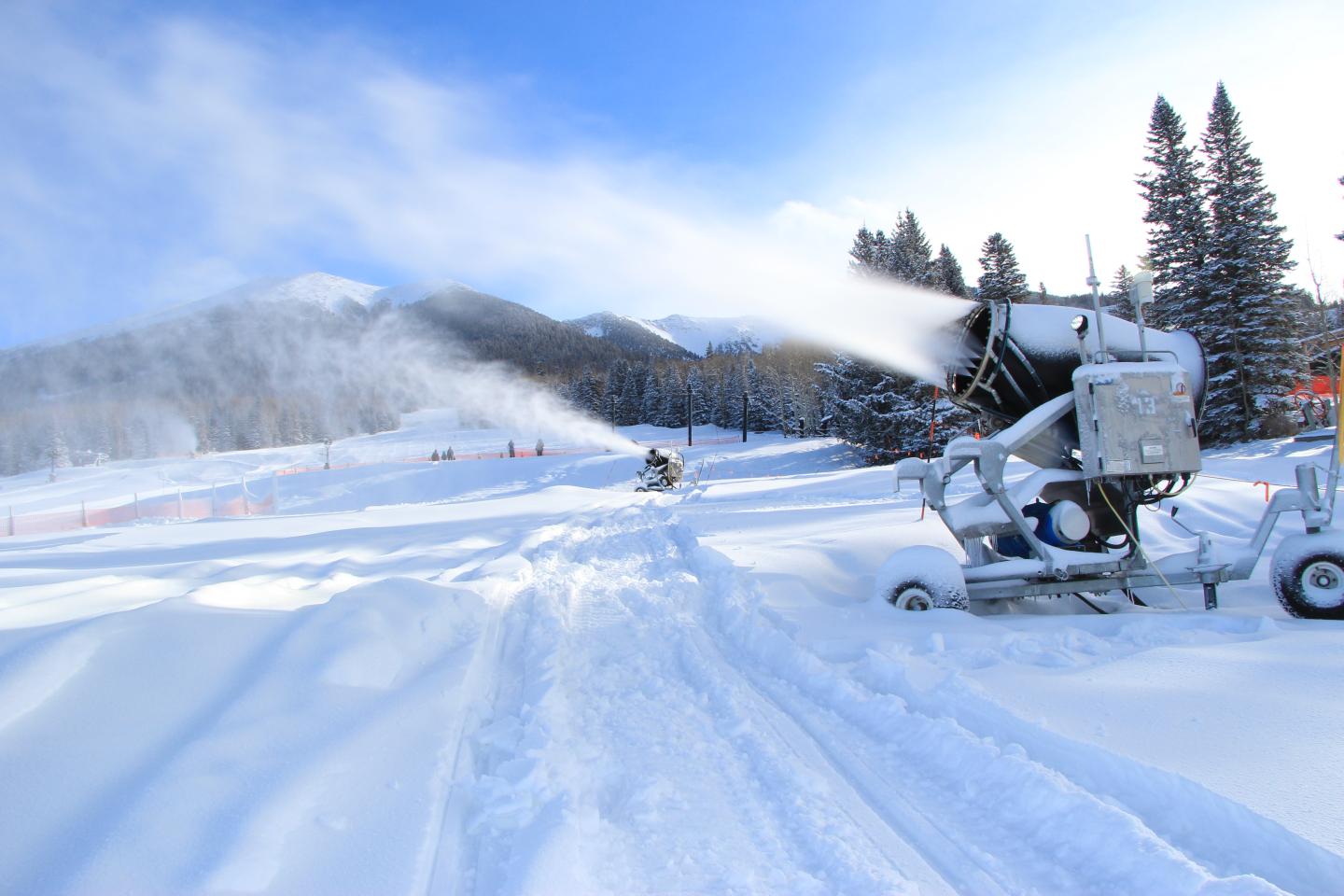 Snowmakers blowing snow on a mountain