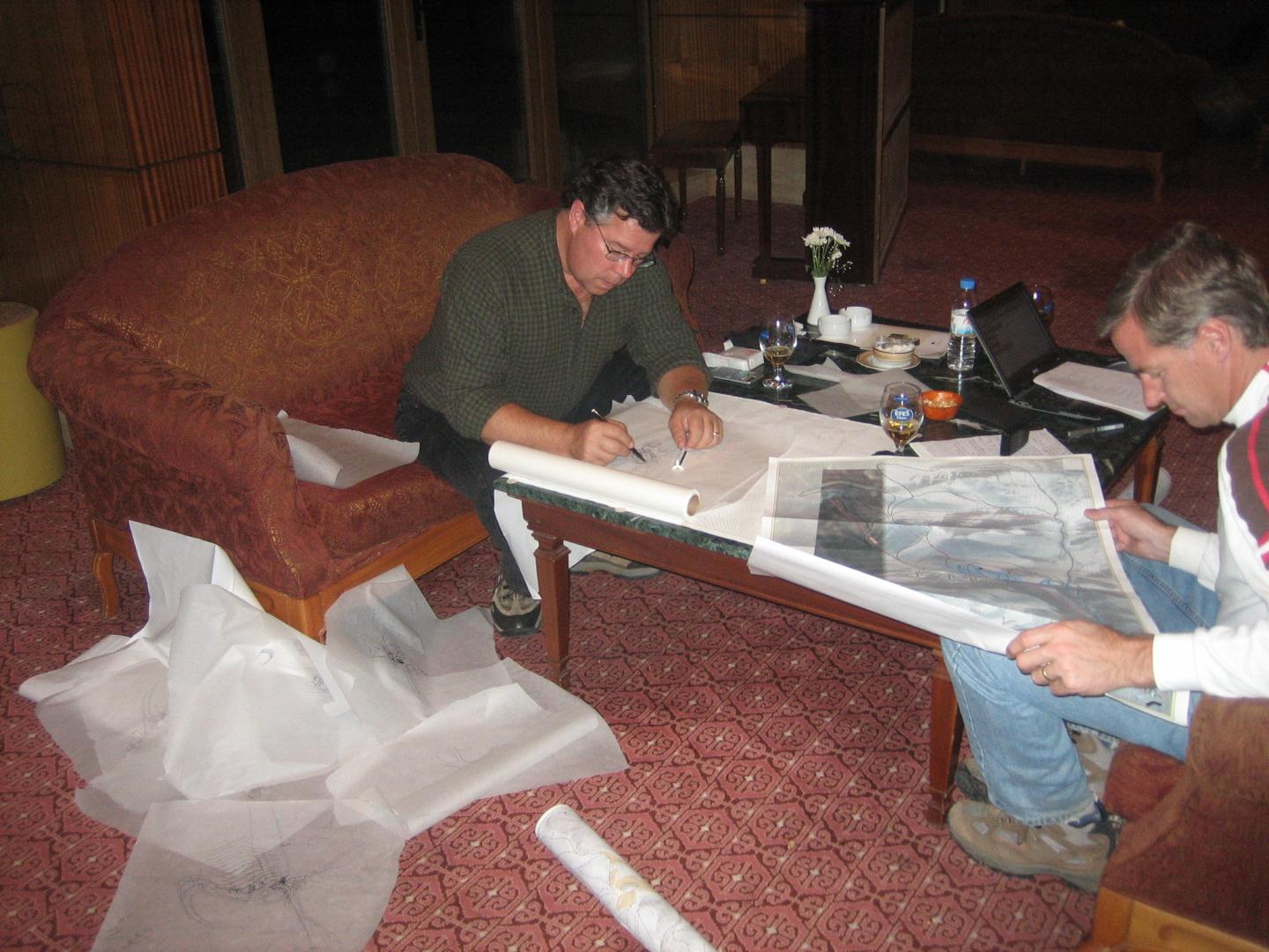 Two people working on resort plans