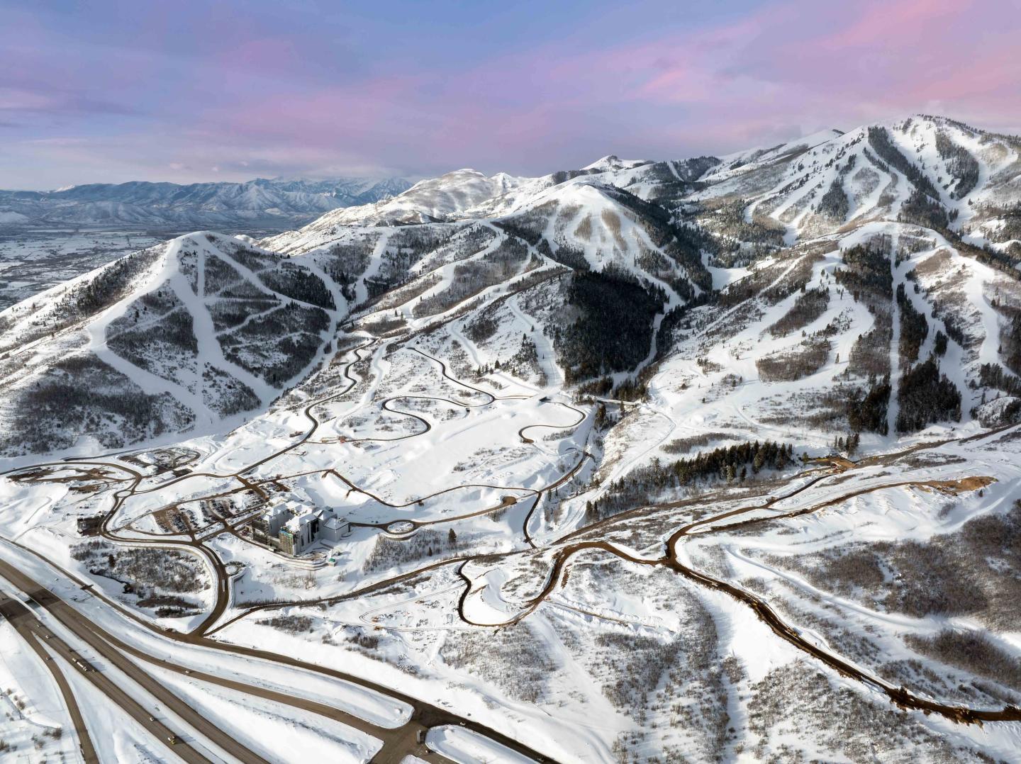 An aerial view of a ski resort at sunset