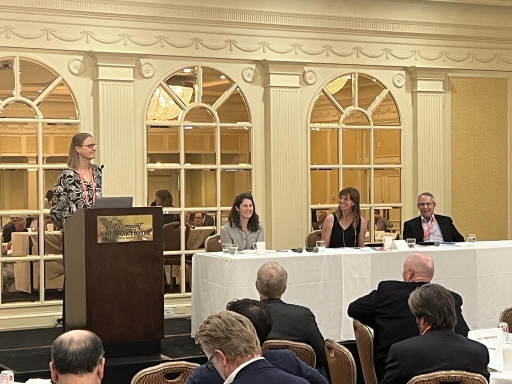 A panel of speakers at an event