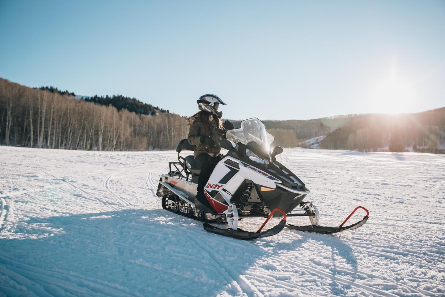 Snowmobiler in the sun