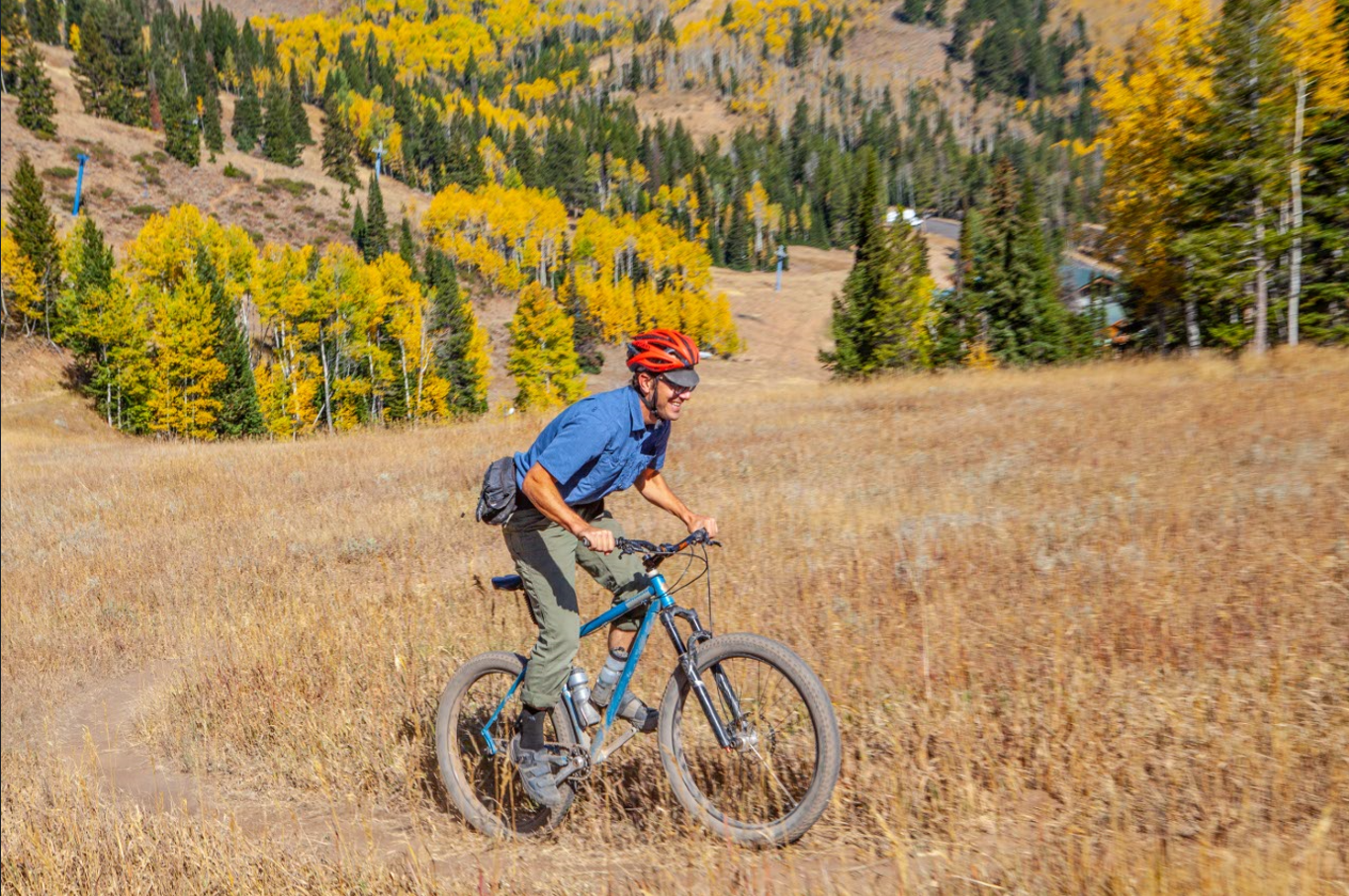 Dayton Crites riding his mountain bike in the mountains