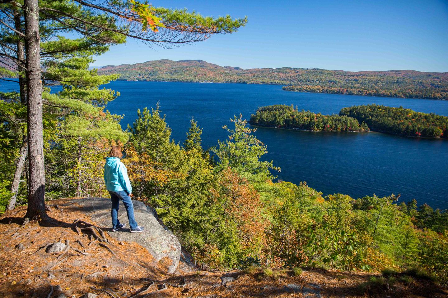 Person looking at lake from mountain