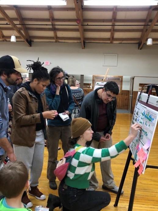 Group discussing plans at open house