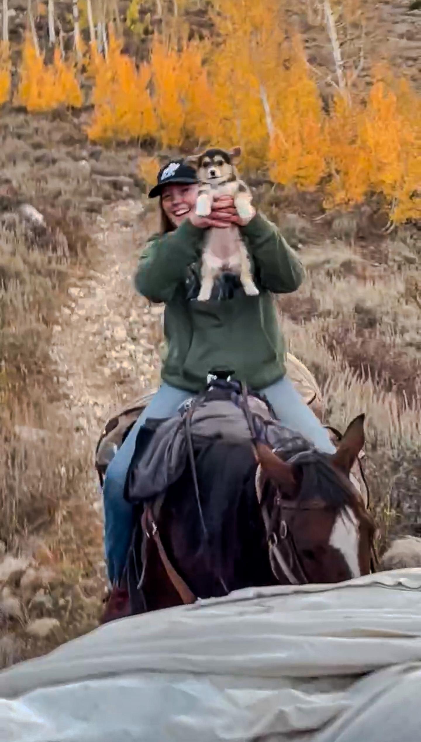 Ellianna and a pup horseback riding